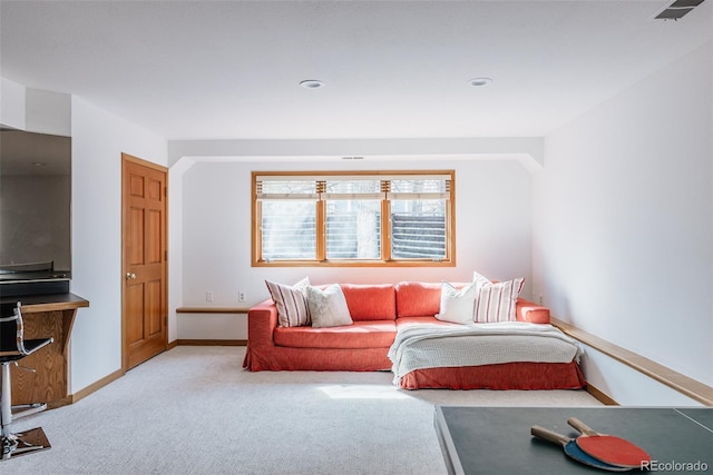 living area with baseboards, recessed lighting, visible vents, and light colored carpet