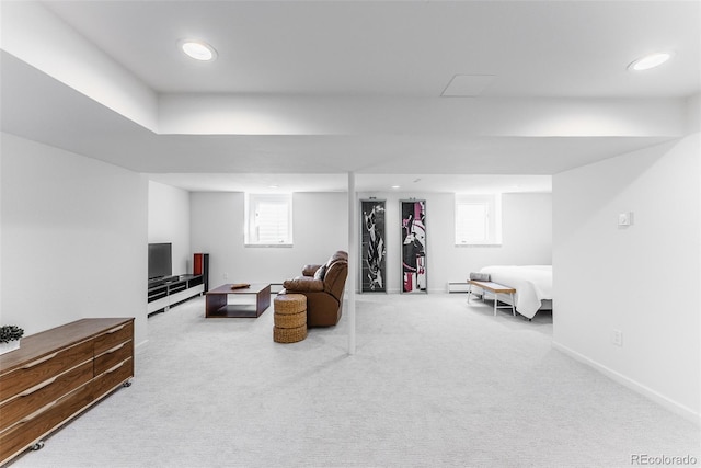 living area featuring carpet, baseboards, and baseboard heating