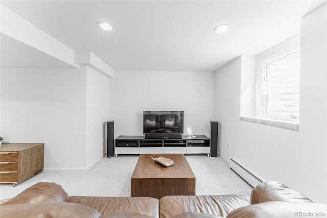 living room with a baseboard radiator, baseboards, and carpet