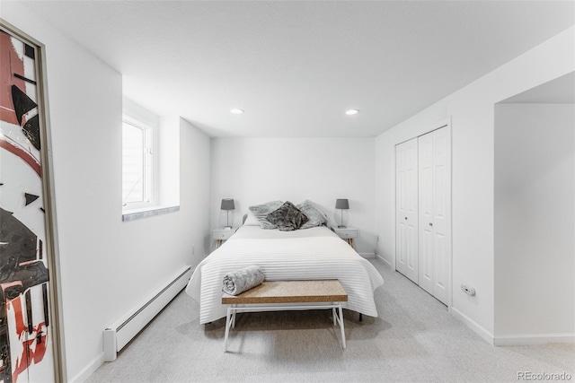 carpeted bedroom with baseboards, a baseboard heating unit, a closet, and recessed lighting