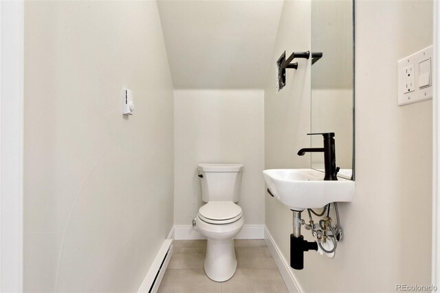 1563 N Hooker St, Denver, CO 80204 - half bathroom with toilet, tile patterned flooring, a sink, and baseboards