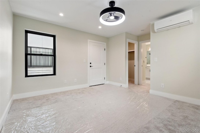 1563 N Hooker St, Denver, CO 80204 - unfurnished room with a wall mounted air conditioner, light carpet, baseboards, and recessed lighting