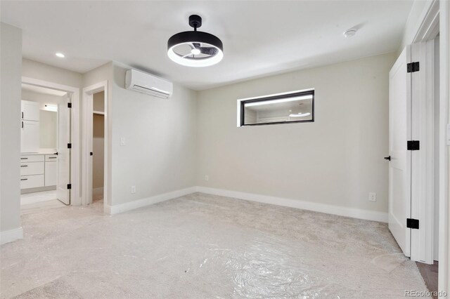 1563 N Hooker St, Denver, CO 80204 - unfurnished bedroom featuring a wall mounted AC, light carpet, baseboards, ensuite bathroom, and recessed lighting
