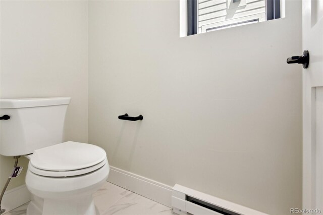 1563 N Hooker St, Denver, CO 80204 - bathroom featuring marble finish floors, a baseboard heating unit, toilet, and baseboards