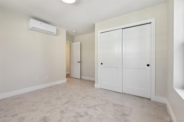 1563 N Hooker St, Denver, CO 80204 - unfurnished bedroom with a wall mounted air conditioner, carpet, a closet, and baseboards