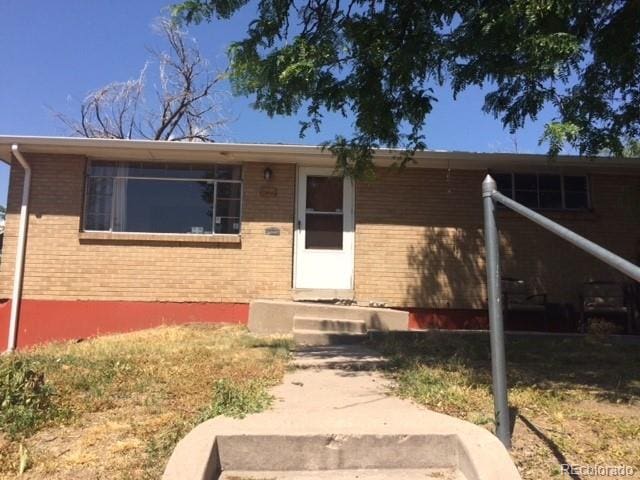 1255 Yates St, Denver, CO 80204 - view of front of property with brick siding and entry steps