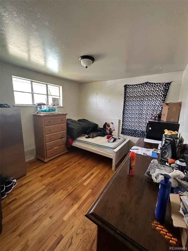 1255 Yates St, Denver, CO 80204 - bedroom with light wood-type flooring