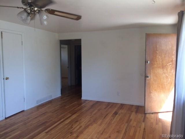 1255 Yates St, Denver, CO 80204 - spare room featuring a ceiling fan and wood finished floors