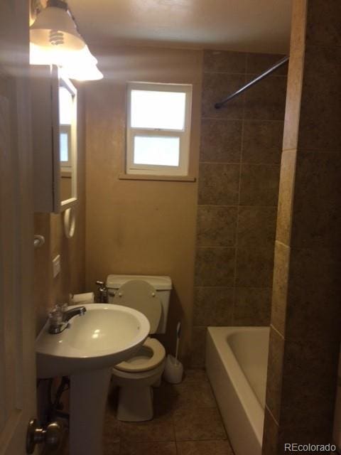 1255 Yates St, Denver, CO 80204 - bathroom with tile patterned flooring and shower / tub combination