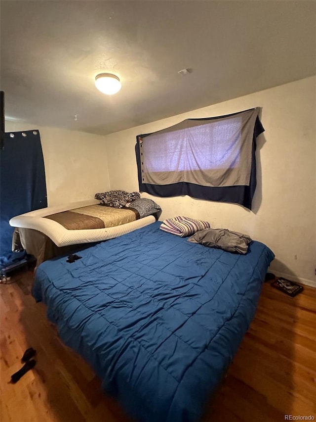 1255 Yates St, Denver, CO 80204 - bedroom with wood finished floors and baseboards
