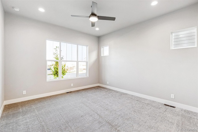 empty room featuring carpet and ceiling fan