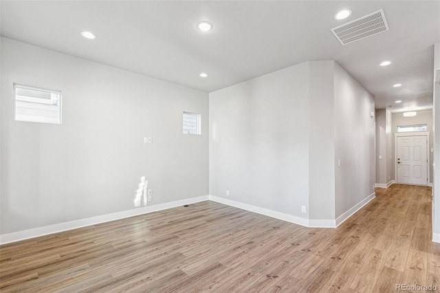 unfurnished room featuring light wood-type flooring