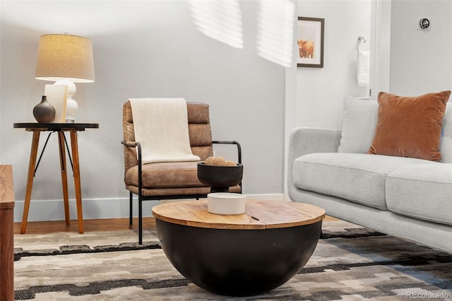 living area with hardwood / wood-style flooring