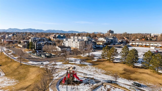 snowy aerial view with a mountain view