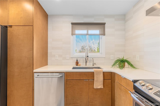 3035 E Maplewood Ave, Centennial, CO 80121 - kitchen featuring light countertops, stainless steel appliances, brown cabinetry, and a sink