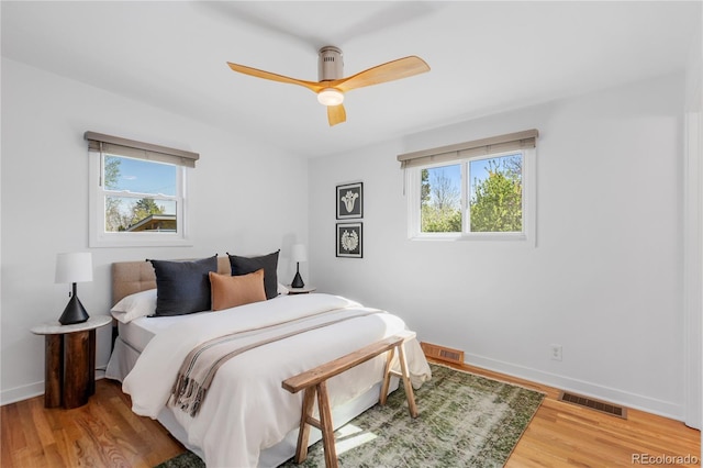 3035 E Maplewood Ave, Centennial, CO 80121 - bedroom featuring baseboards, visible vents, ceiling fan, and light wood finished floors
