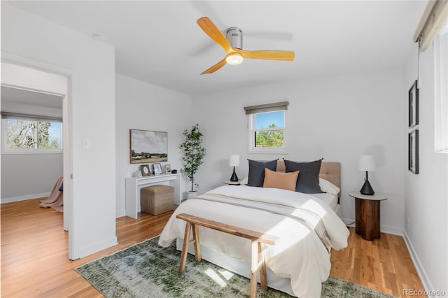 3035 E Maplewood Ave, Centennial, CO 80121 - bedroom featuring baseboards, ceiling fan, and light wood-style flooring