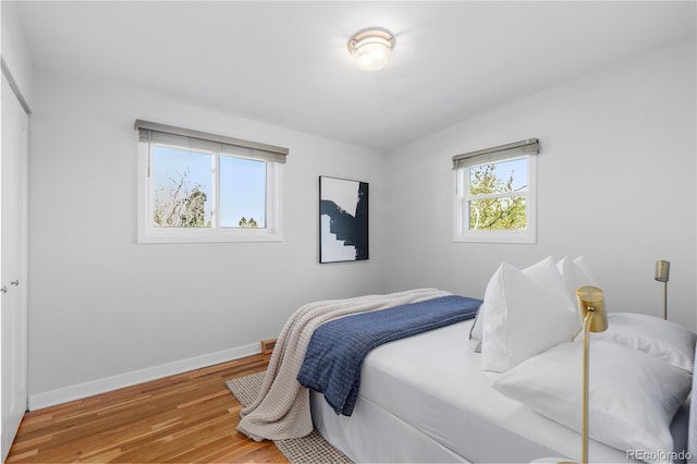 3035 E Maplewood Ave, Centennial, CO 80121 - bedroom with baseboards and wood finished floors
