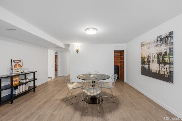 3035 E Maplewood Ave, Centennial, CO 80121 - dining room featuring baseboards, visible vents, and light wood-style floors