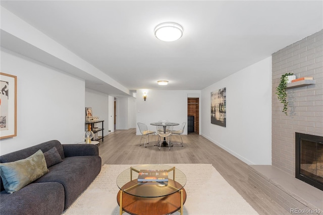3035 E Maplewood Ave, Centennial, CO 80121 - living area with a brick fireplace and light wood finished floors