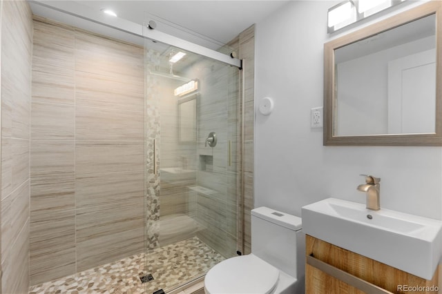 3035 E Maplewood Ave, Centennial, CO 80121 - bathroom with toilet, vanity, and a shower stall