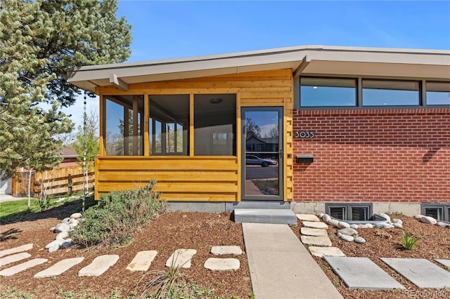 3035 E Maplewood Ave, Centennial, CO 80121 - view of exterior entry featuring brick siding and fence