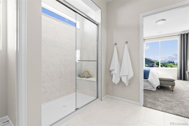 22374 E 49th Pl, Aurora, CO 80019 - ensuite bathroom featuring a shower stall and baseboards