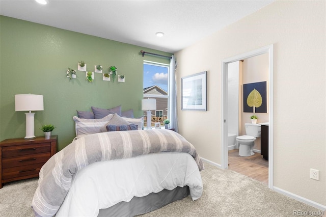 22374 E 49th Pl, Aurora, CO 80019 - bedroom with light carpet and ensuite bath