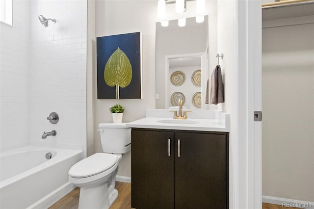 22374 E 49th Pl, Aurora, CO 80019 - bathroom featuring vanity, wood finished floors, and shower / bath combination