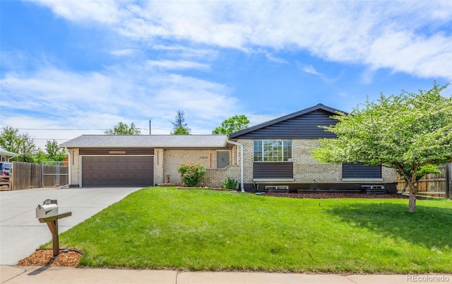13010 W 6th Pl, Golden, CO 80401 - view of front facade with concrete driveway, brick siding, and an attached garage