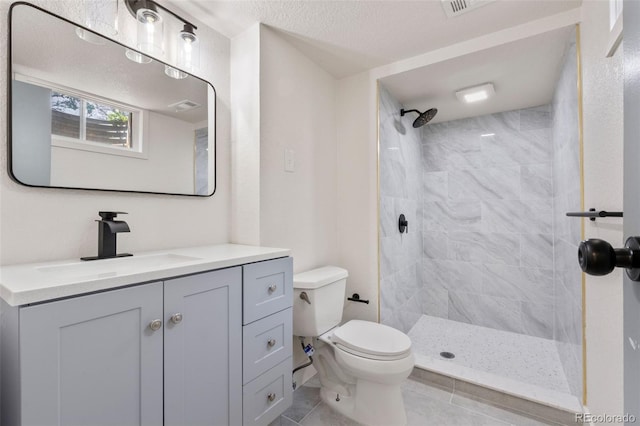 13010 W 6th Pl, Golden, CO 80401 - full bath with toilet, vanity, tiled shower, and tile patterned flooring