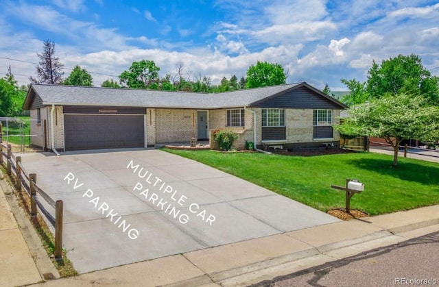13010 W 6th Pl, Golden, CO 80401 - ranch-style home with a garage, concrete driveway, brick siding, and a front lawn