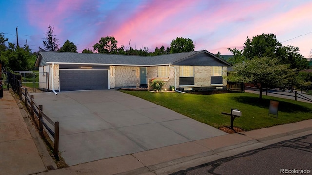 13010 W 6th Pl, Golden, CO 80401 - ranch-style house with brick siding, a garage, and driveway