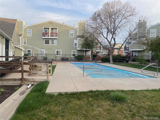 962 S Dearborn Way Unit 19, Aurora, CO 80012 - community pool with fence, a wooden deck, and a residential view