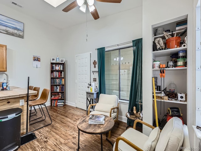 962 S Dearborn Way Unit 19, Aurora, CO 80012 - office area with wood finished floors, a ceiling fan, a sink, visible vents, and baseboards