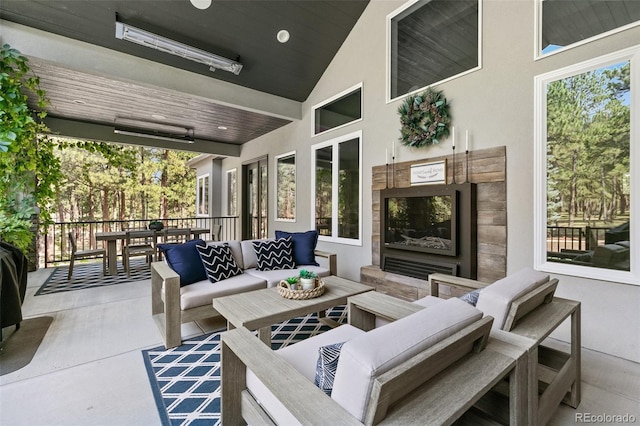 sunroom with vaulted ceiling and wooden ceiling