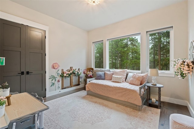 interior space featuring wood finished floors and baseboards