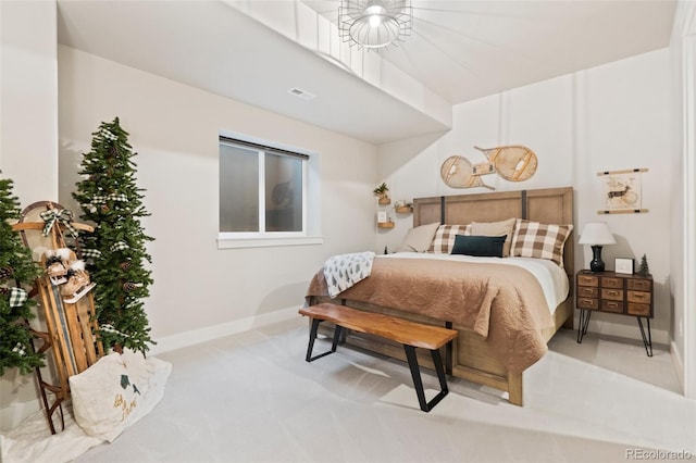 bedroom featuring visible vents and baseboards