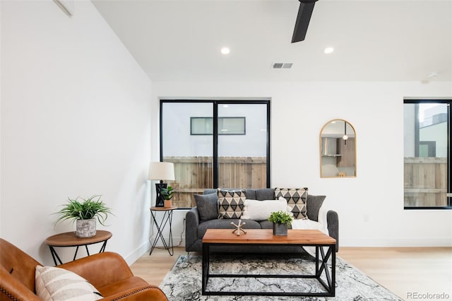 3433 Lawrence St Unit 1, Denver, CO 80205 - living room with light wood-type flooring, ceiling fan, recessed lighting, and baseboards