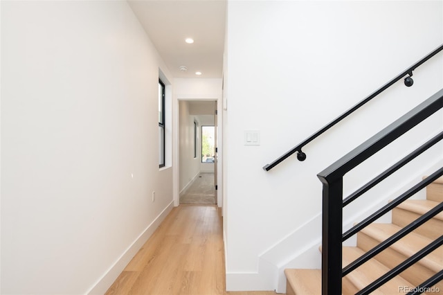 3433 Lawrence St Unit 1, Denver, CO 80205 - staircase featuring wood finished floors, recessed lighting, and baseboards