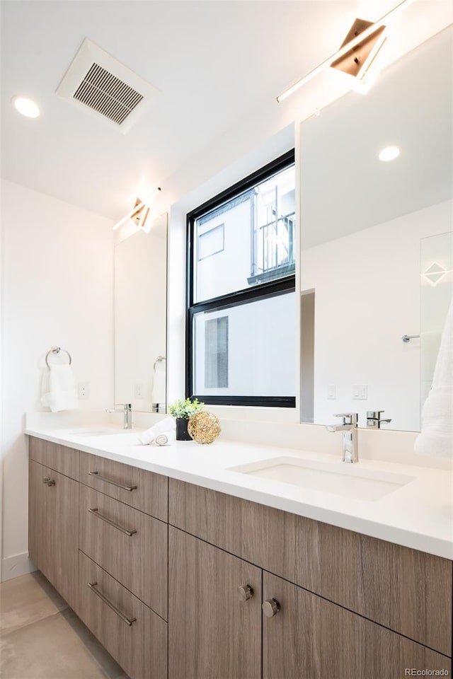 3433 Lawrence St Unit 1, Denver, CO 80205 - full bath featuring double vanity and recessed lighting