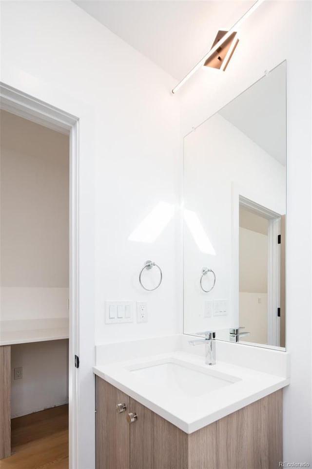 3433 Lawrence St Unit 1, Denver, CO 80205 - bathroom featuring vanity and wood finished floors