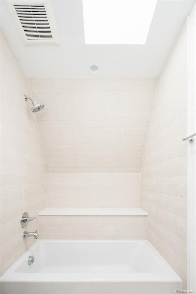 3433 Lawrence St Unit 1, Denver, CO 80205 - full bathroom featuring bathtub / shower combination and a skylight
