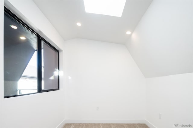 3433 Lawrence St Unit 1, Denver, CO 80205 - bonus room with recessed lighting, vaulted ceiling, carpet, a skylight, and baseboards