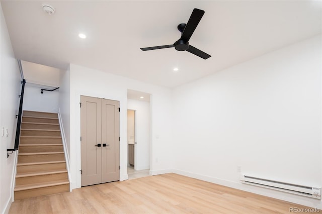 3433 Lawrence St Unit 1, Denver, CO 80205 - unfurnished bedroom featuring a baseboard heating unit, light wood finished floors, recessed lighting, baseboards, and ceiling fan