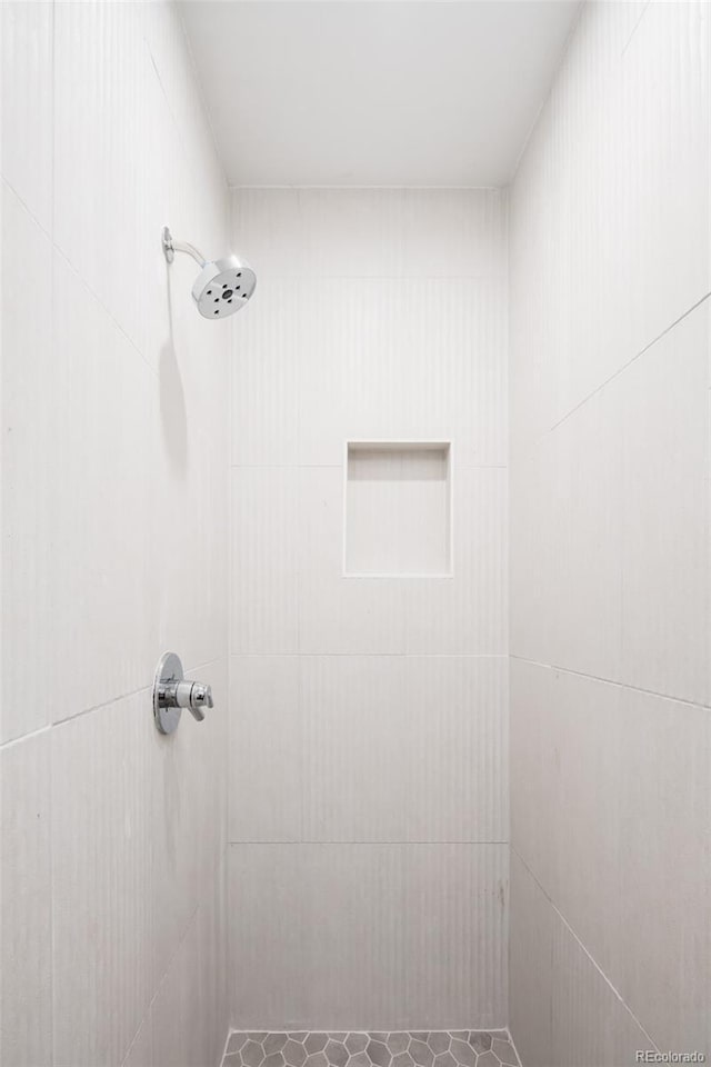 3433 Lawrence St Unit 1, Denver, CO 80205 - full bathroom featuring a tile shower