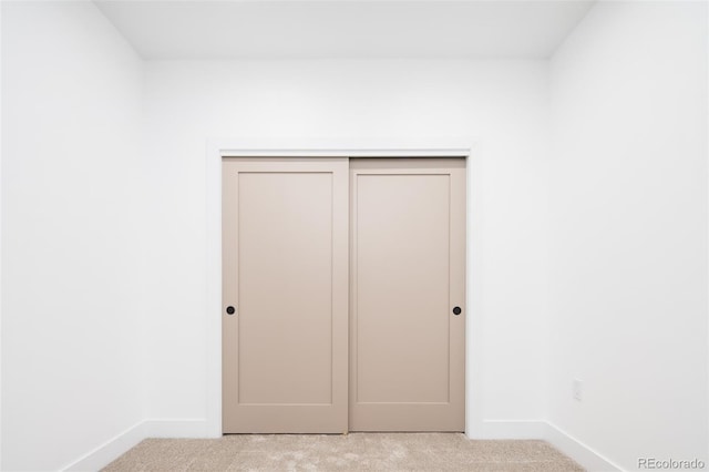 3433 Lawrence St Unit 1, Denver, CO 80205 - unfurnished bedroom featuring carpet floors, baseboards, and a closet