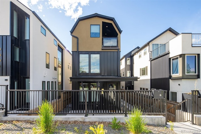 3433 Lawrence St Unit 1, Denver, CO 80205 - rear view of house featuring fence and stucco siding