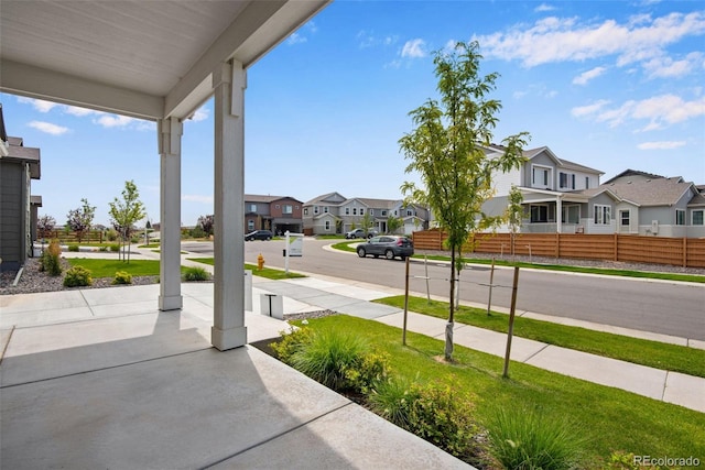 13351 E 100th Pl, Commerce City, CO 80022 - view of yard with a porch, fence, and a residential view