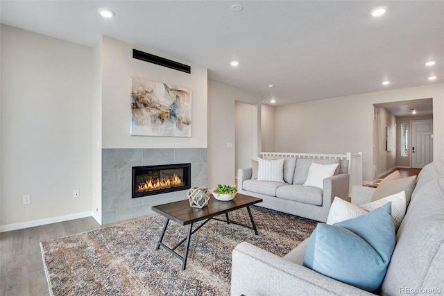 living room featuring hardwood / wood-style floors and a fireplace